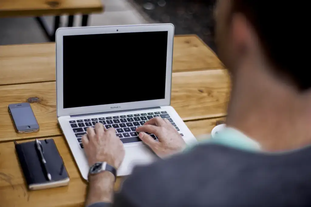 GPT-6: Man typing on laptop (Unsplash)