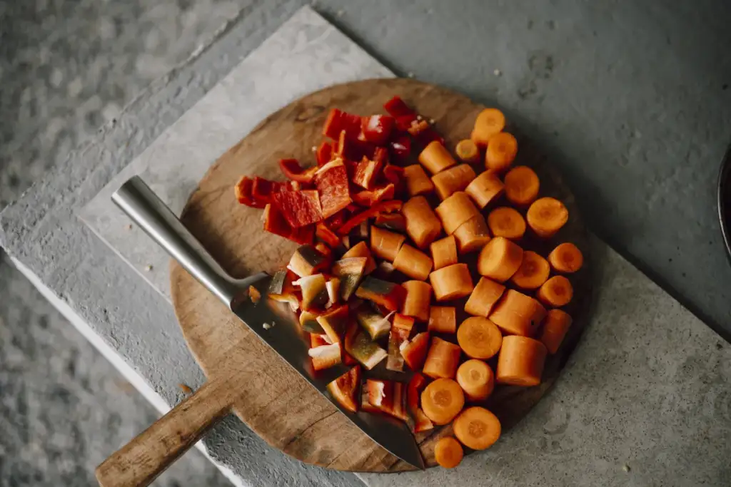 meal prep ideas: Freshly chopped vegetables on a wooden cutting board