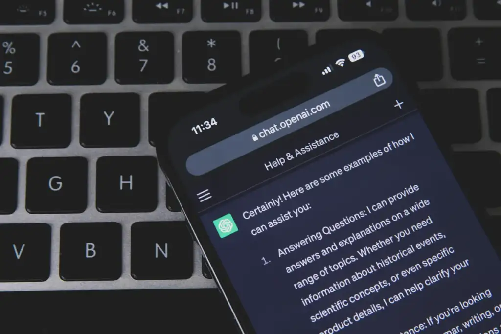prompt injection: Smartphone with ChatGPT on keyboard (52917311050)