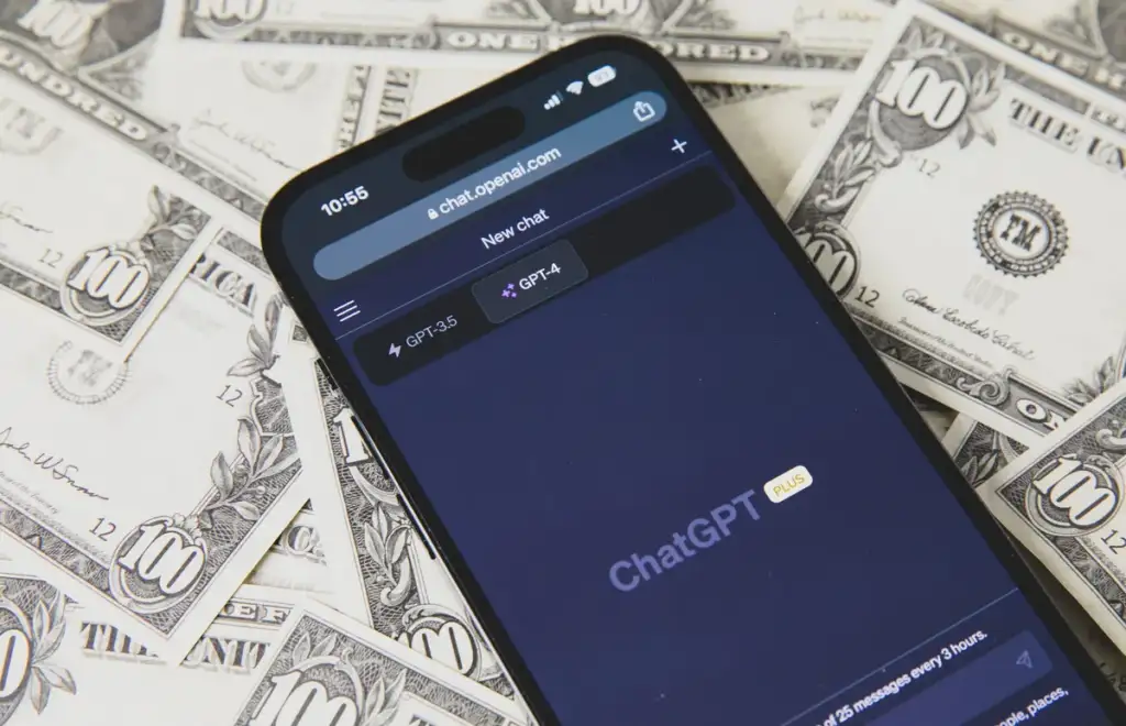ChatGPT Dots pricing: Smartphone with ChatGPT on the US dollar banknotes background (52917311070)